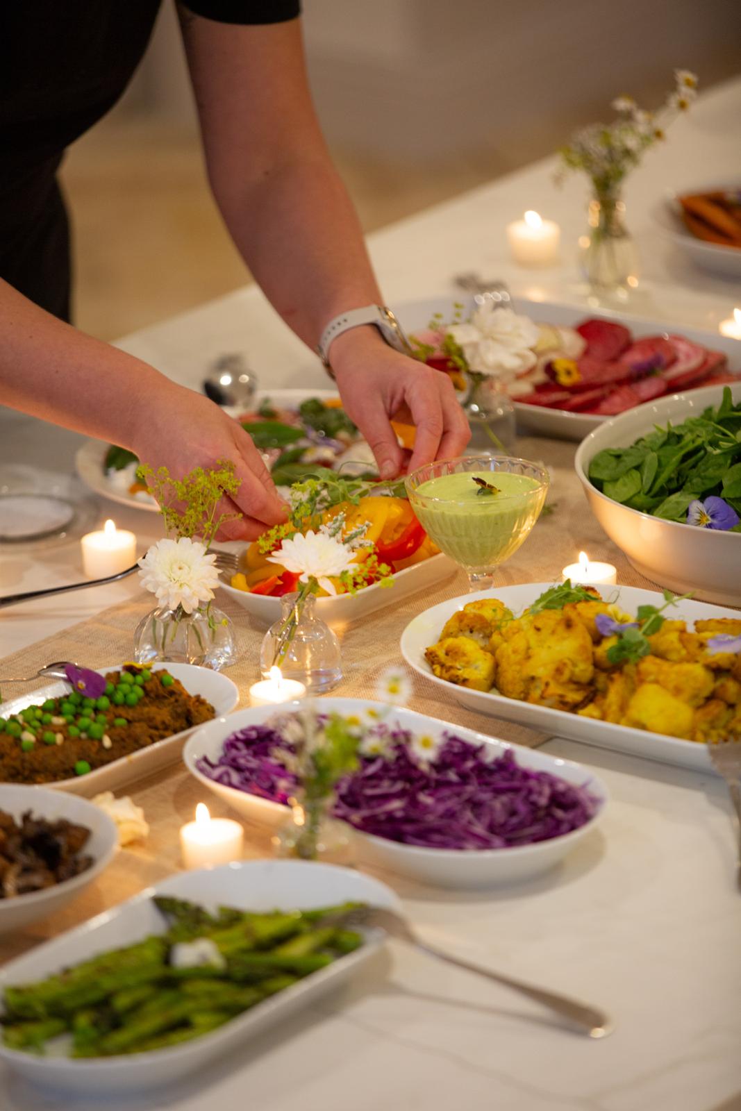 Private chef arranging a candlelit table