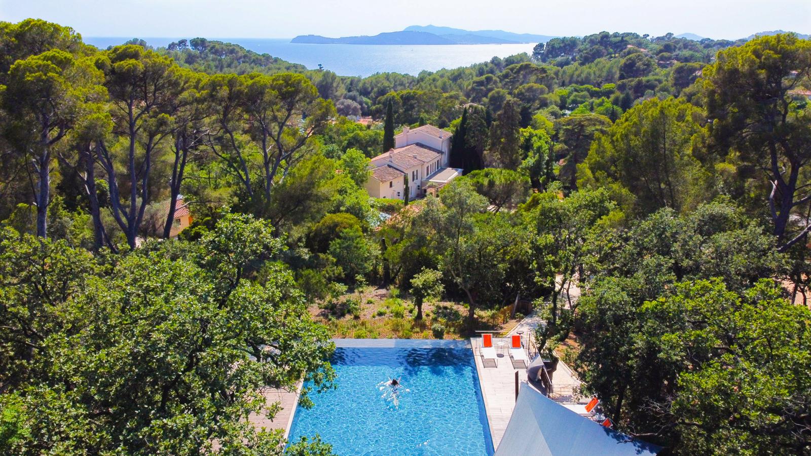 Provençal villa with infinity pool among pines, sea and islands beyond